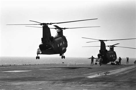 Two Ch 46 Sea Knight Helicopters Land Aboard The Aircraft Carrier Uss