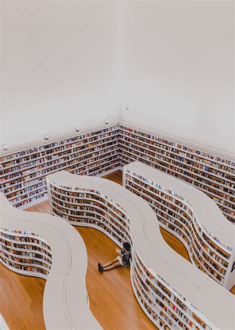 Person Inside Library Photo Free Indoors Image On Unsplash
