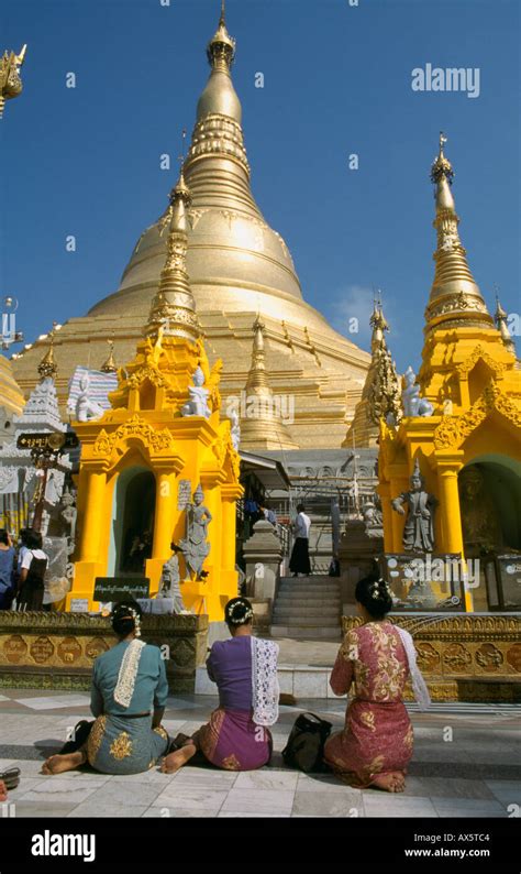 Women Praying At The Shwedagon Pagoda In Yangon Myanmar Stock Photo