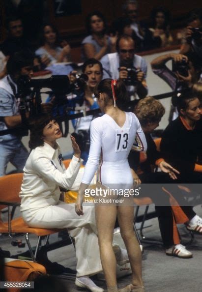 Rear View Of Romania Nadia Comaneci Victorious During Women S