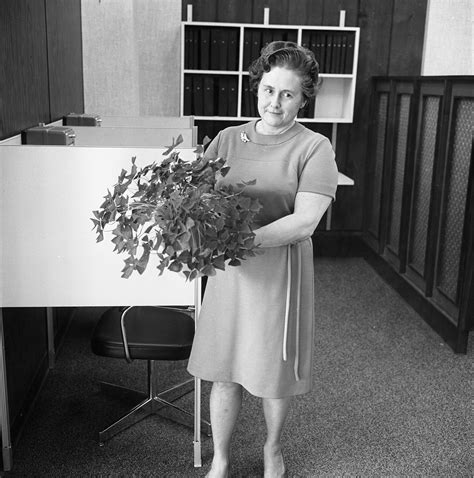 mrs frances steencken shows off her shamrock plant on st patrick s day march 1969 ann arbor