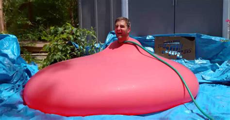 Do You Want To Watch A Man Put Himself Into A Giant Water Balloon And Burst It In Slow Motion
