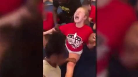 high school cheerleader screams as she s forced to do splits