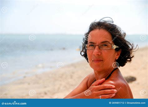 Portrait Of Pretty Tanned Mature Woman With Glasses Stock Photo Image