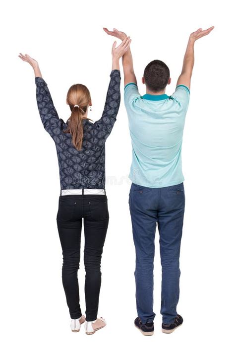 Back View Couple Looking At Wall And Holds Hand Up Stock Photo Image