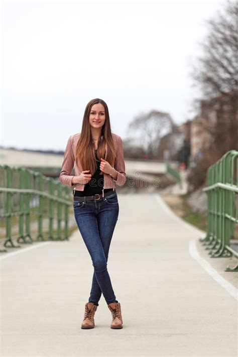 brunette girl wearing leather jacket blue jeans and boots stock image image of jacket casual