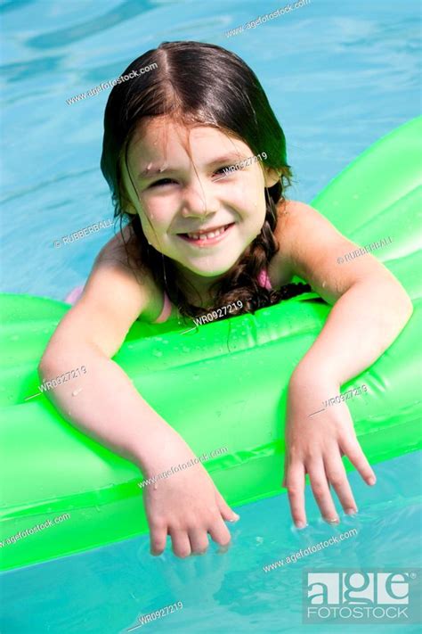 Girl On Floatation Device Stock Photo Picture And Royalty Free Image Pic WR
