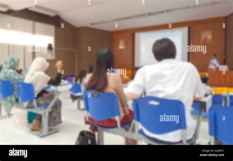 Blurred At Business Photo Of Conference Hall Or Seminar Room With Attendee Background Stock