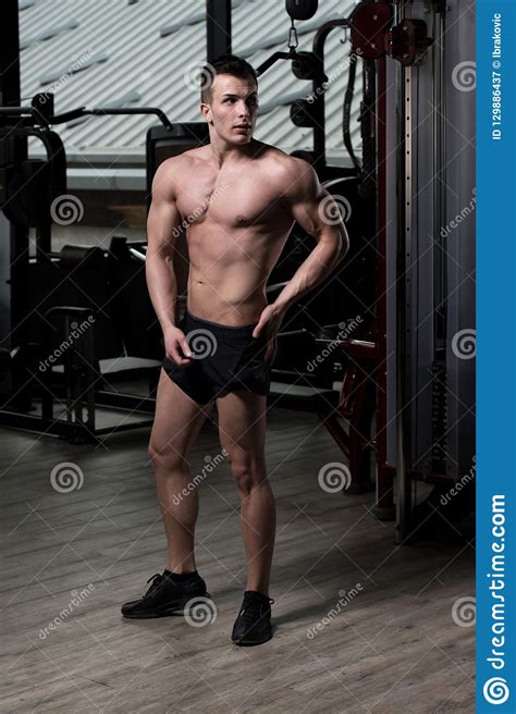 Handsome Muscular Man Flexing Muscles In Gym Stock Image Image Of