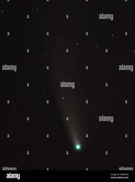 Comet Neowise Appearing In The Night Sky Over Stonehenge In Wiltshire
