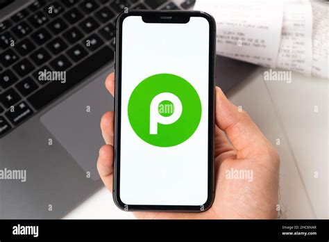 Publix application on the screen of Apple iPhone in mans hand and