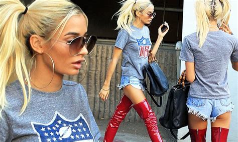 Pia Mia Flashes Some Thigh In Outrageous Red Latex Boots And Tiny Denim