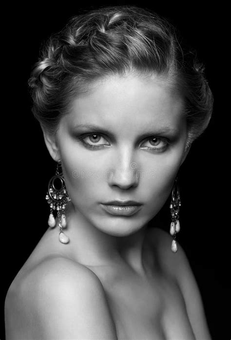 Black And White Portrait Of Young Beautiful Woman On Black Stock Image