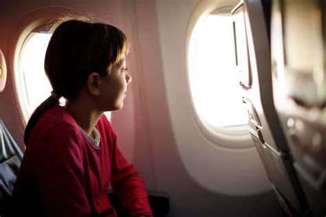 Girl Looking Out Plane Window Stock Photos Pictures And Royalty Free