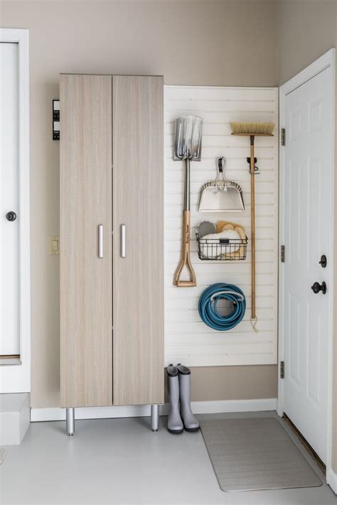 Sleek and stylish, this entryway furniture is capped off by you can make a tight space feel brighter and more open with white mudroom furniture. Entryway Organization with Tall Cabinet and Slatwall ...