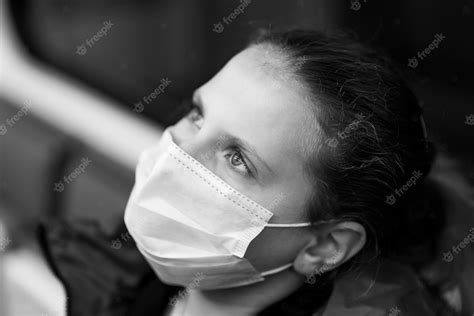Premium Photo Nice Pretty Worried Young Girl Wearing Mask And