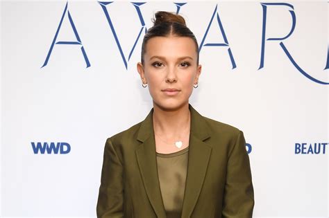 Millie Bobby Brown Sports A Parted Fringe And Long Wavy Hair