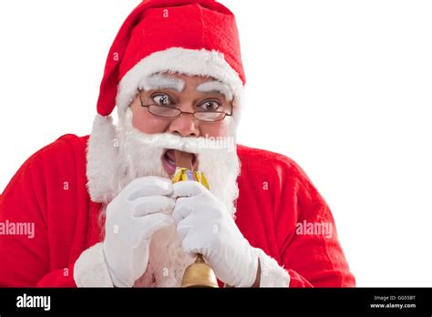 Close Up Of Santa Claus Eating Chocolate Bar Over White Background