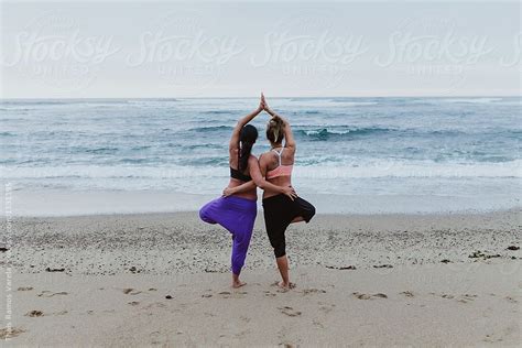Women Doing Yoga Exersices On The Beach By Thais Ramos Varela For Stocksy United Beach Yoga