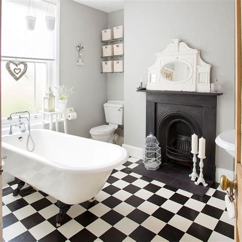 The rough brick wall and unfinished wood table of this space contrast with the smooth, geometrical look of the washbasin and mirror. Bathroom tile ideas