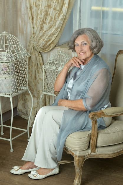 Premium Photo Beautiful Mature Woman Sitting On Vintage Chair