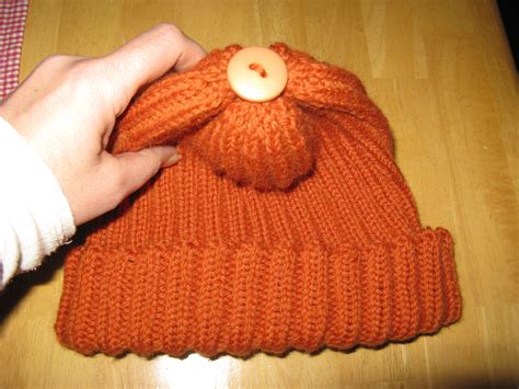 2 x 2 ribbed wool hat with button accent. 8mm circular needles. Cast on 102 stitches, knit for ...