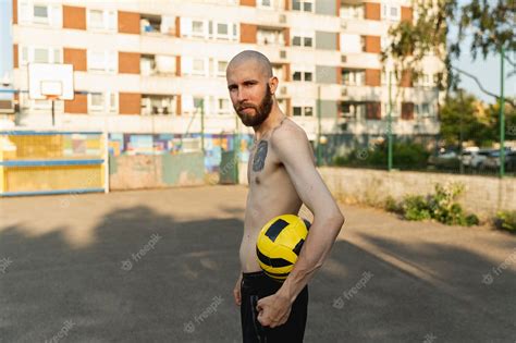 Free Photo Man Holding Ball Medium Shot
