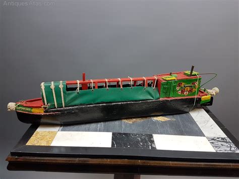 Click the shop button to the right of your screen, then click the settings button that looks like a gear and scroll down to the very bottom. Antiques Atlas - Vintage Scratch Built Canal Longboat Model