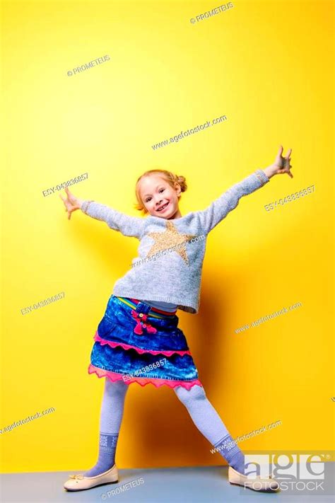 Kids Fashion Portrait Of A Cute Six Year Old Girl Wearing Knitted