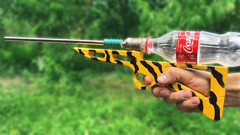 How To Make Powerful Air Rifle At Home Using Coca Cola Bottle Youtube