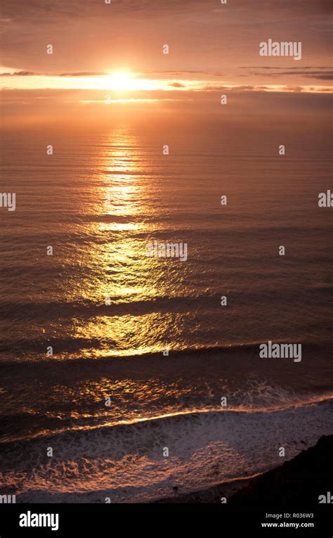 Setting Sun Reflected On Sea Stock Photo Alamy