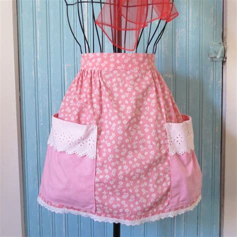 this homemade vintage half apron embodies sweetness with it s pink floral print two big pink