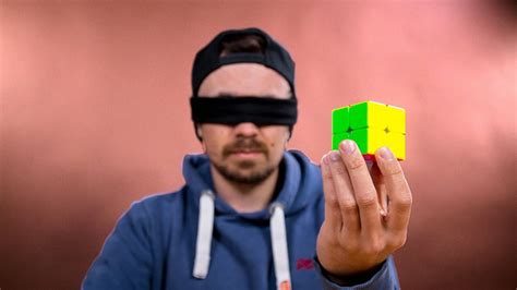 Determined Man Quickly Learns How To Solve A 2x2x2 Rubiks Cube While