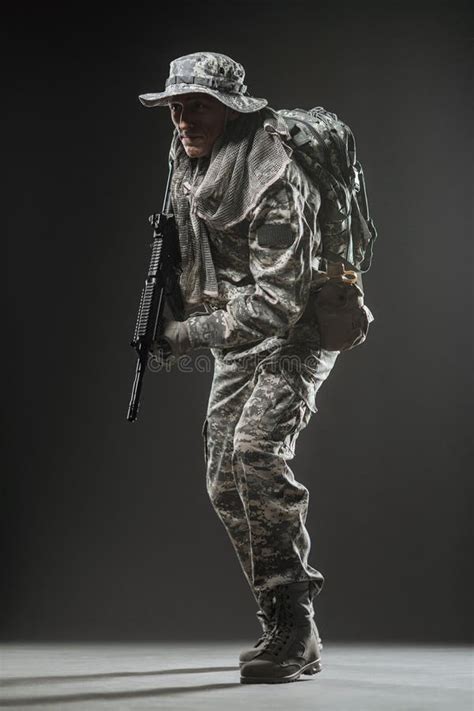 Soldier Man Hold Machine Gun On A White Background Stock Photo Image