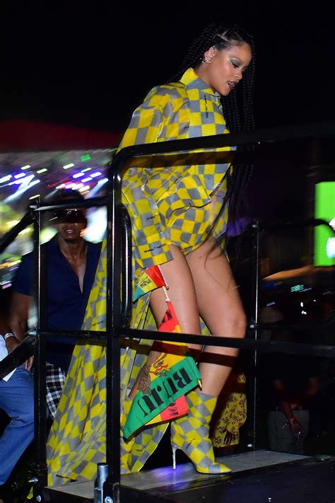 rihanna looks striking in yellow and grey checkered ensemble as she attends buju banton concert
