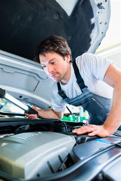 Car Mechanic Team Working In Auto Workshop Stock Photo Image Of