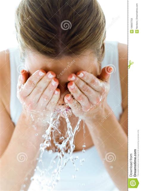 Beautiful Young Woman Washing Her Face Splashing Water In A Home
