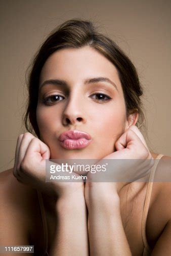Young Woman Making Kissing Lips Toward Camera Photo Getty Images