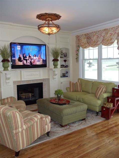 small apartment living room  fireplace furniture arrangement