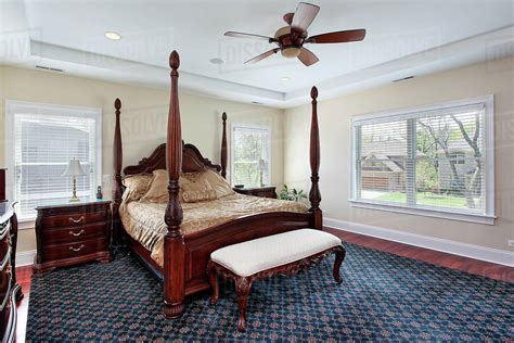 Master Bedroom In Suburban Home With Recessed Ceiling Stock Photo