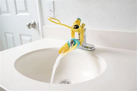 The Aqueduck Faucet Handle Extender Helps Kids Reach The Faucet