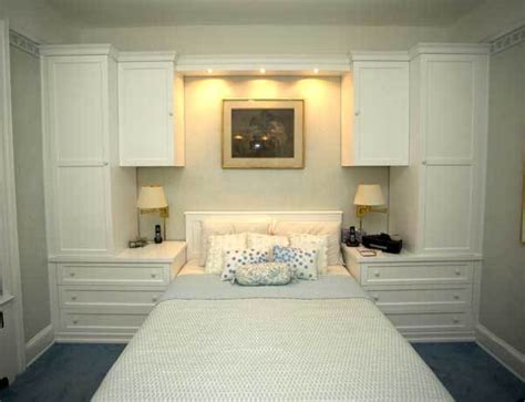 These hanging bedroom cabinets are incredibly efficient in conserving space. CUSTOM - White Built-In Wall Unit With Bed