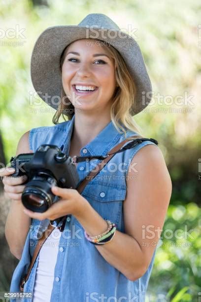 Young Female Nature Photographer Poses For The Camera Stock Photo