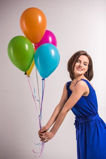Premium Photo Smiling Young Beauty Woman Holding Colorful Balloons