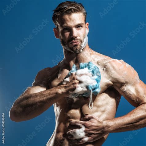 spa and beauty relax and hygiene healthcare handsome man washing with sponge in shower