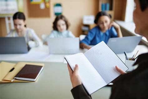 Teacher Giving Homework To Children At Lesson Stock Photo Image Of