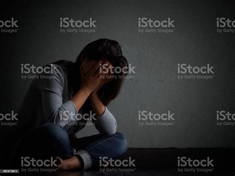 Sad Woman Hug Her Knee And Cry Sad Woman Sitting Alone In A Empty Room