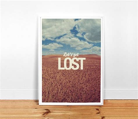 A Poster With The Words Lost On It In Front Of A White Wall And Wooden