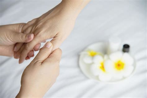 Hand Spa Massage Over Clean White Bed Background People Relax With Hand Massage Service