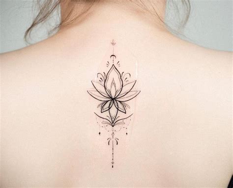 Ornamental Lotus Flower Tattoo On The Upper Back